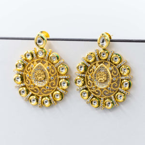 Gold Kundan earrings.